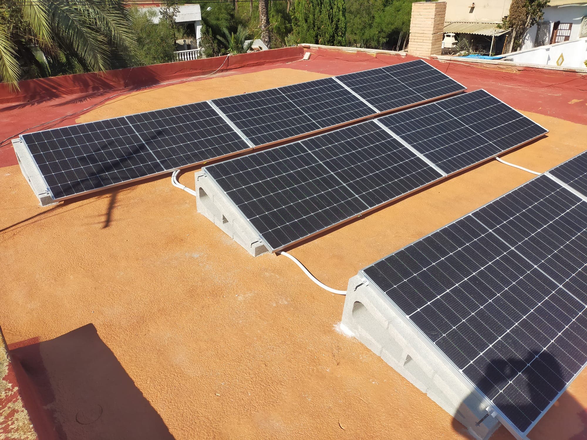 Panels aligned along the ridge of a Spanish roof