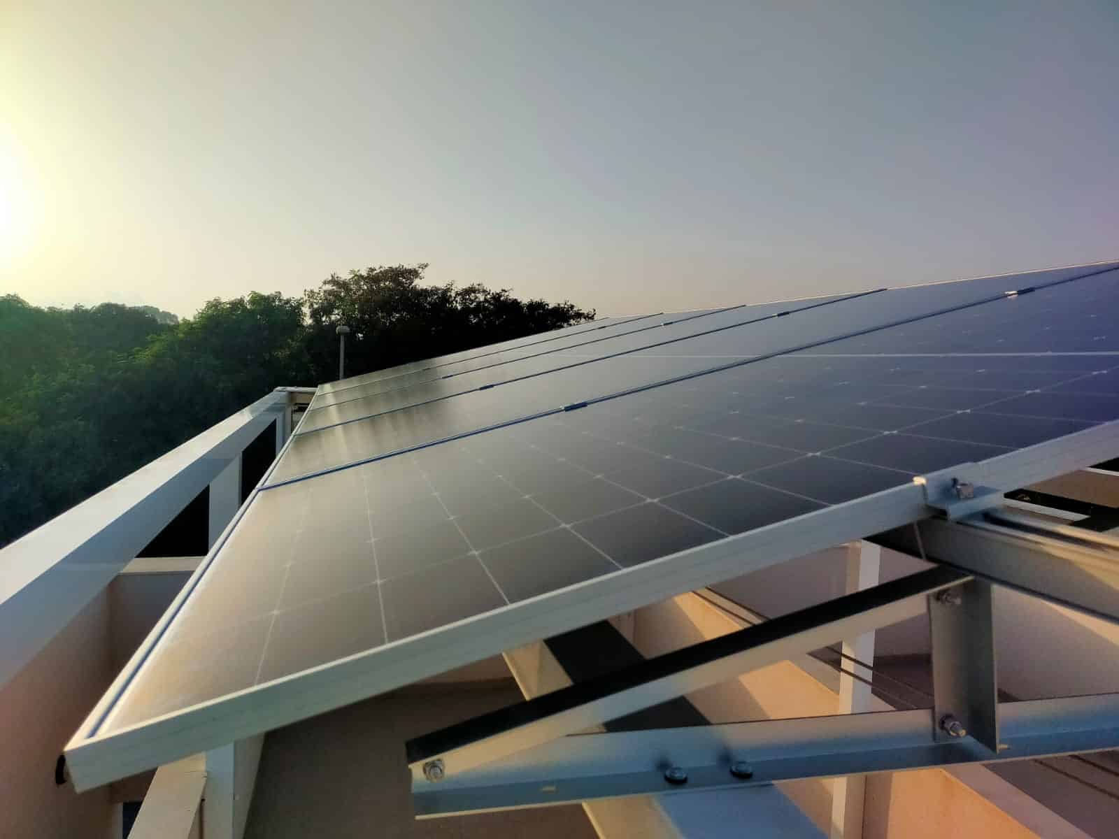 Solar array on a Costa Blanca roof catching low evening sun
